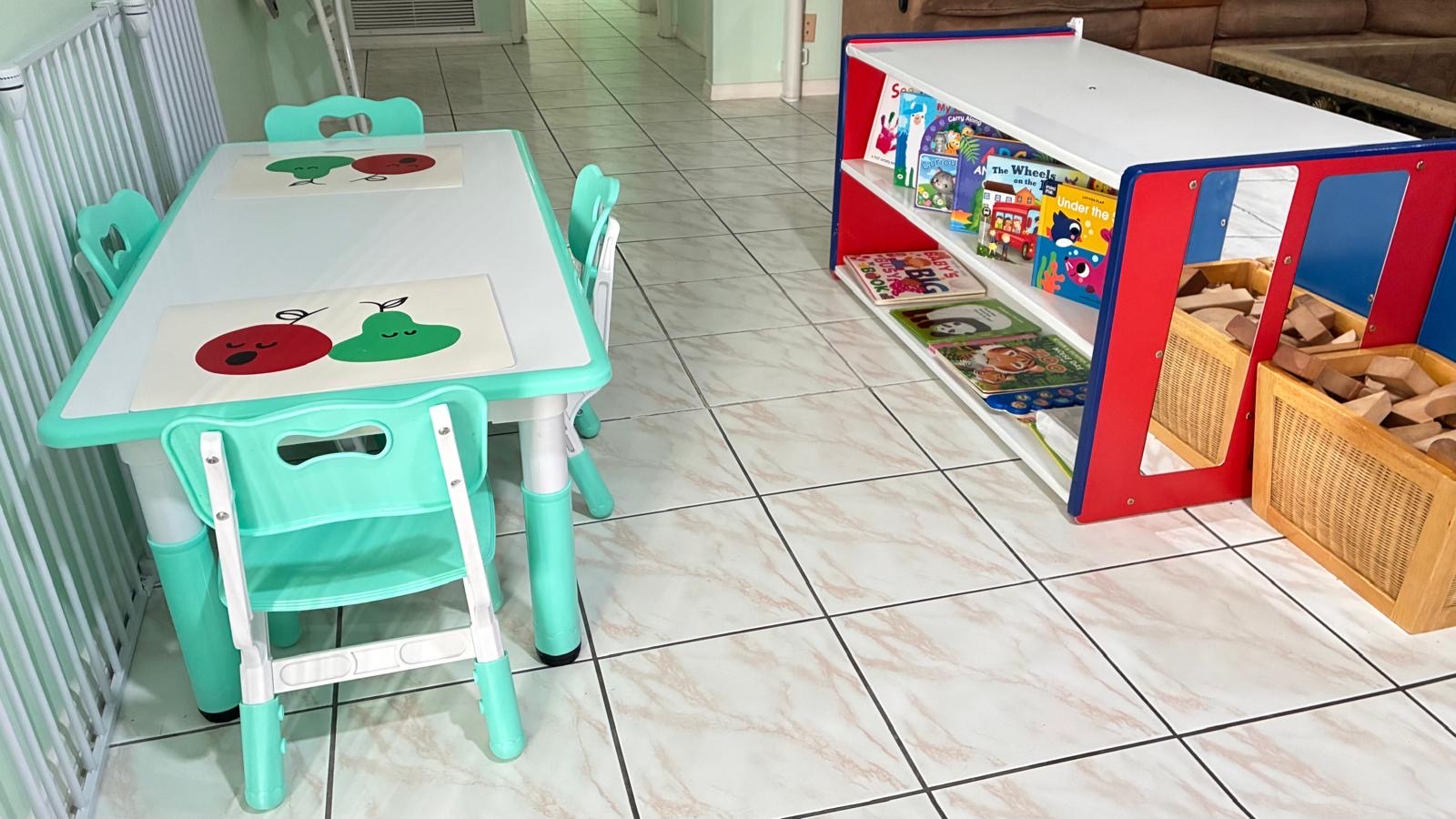 Indoor reading table and low bookshelf area for children